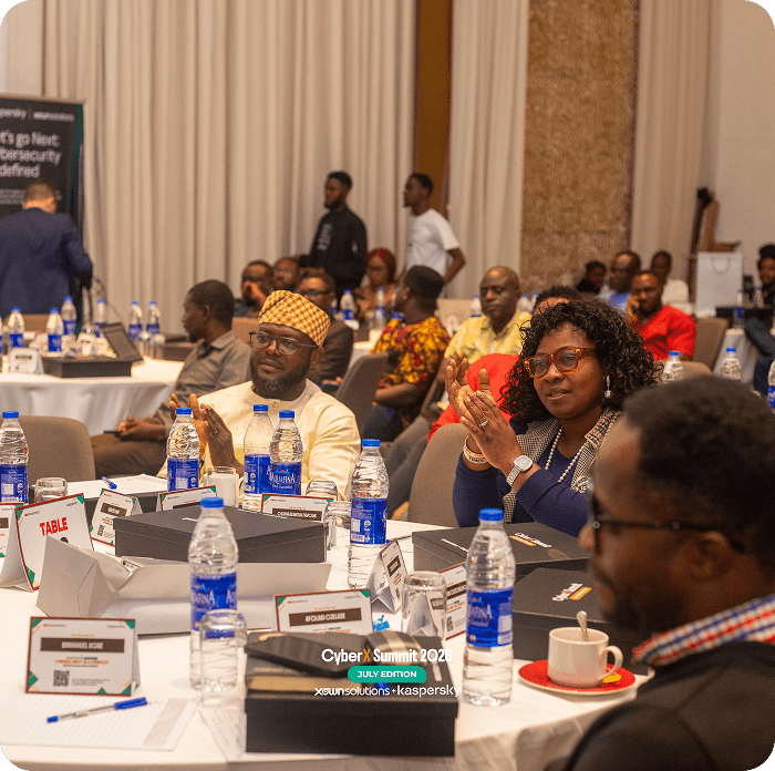 Executives seated at tables during a DigitalX session